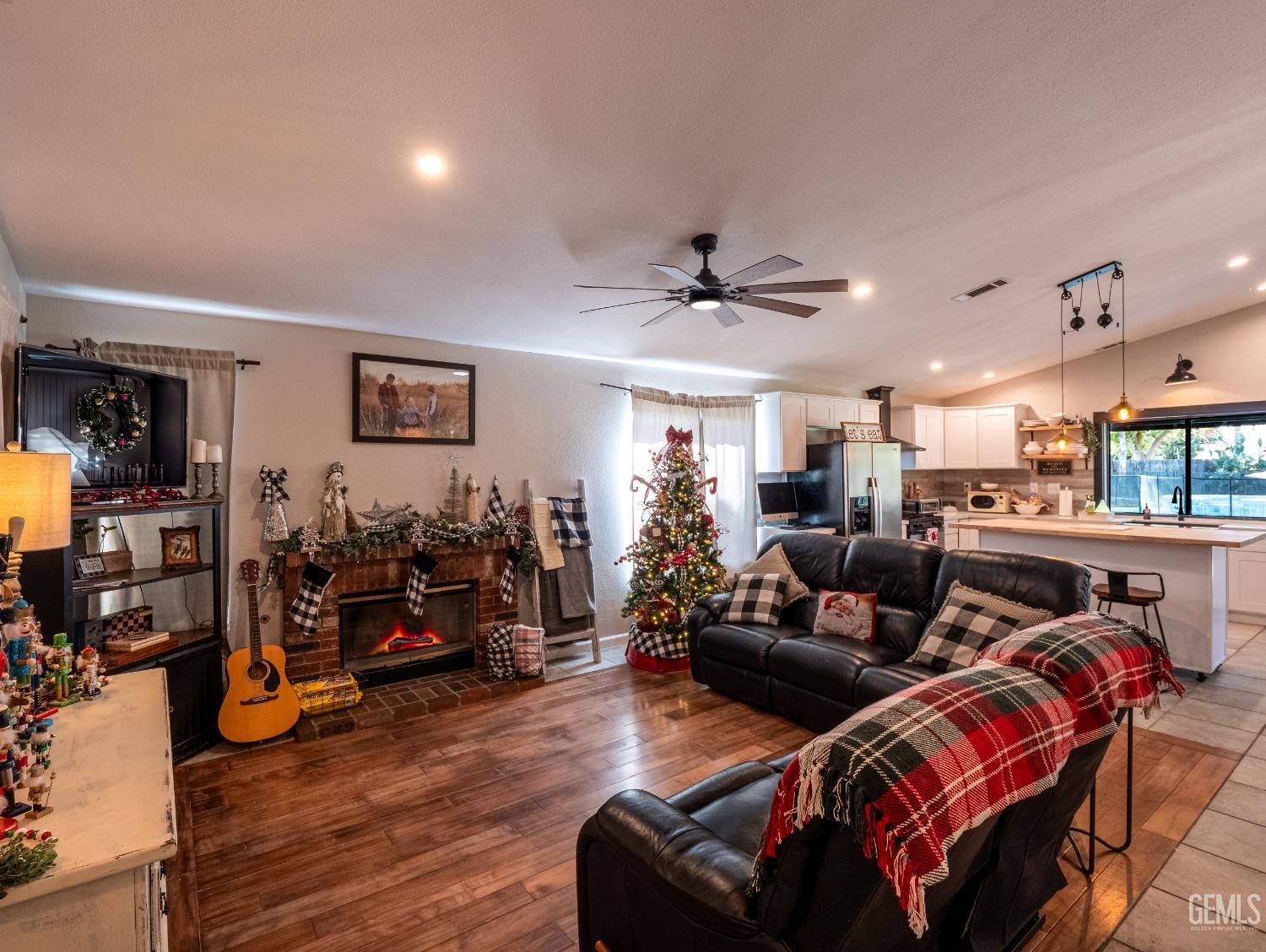 Undisclosed Address Bakersfield, CA 93312 - Photo 4 of 25 a living room with furniture and a wooden floor