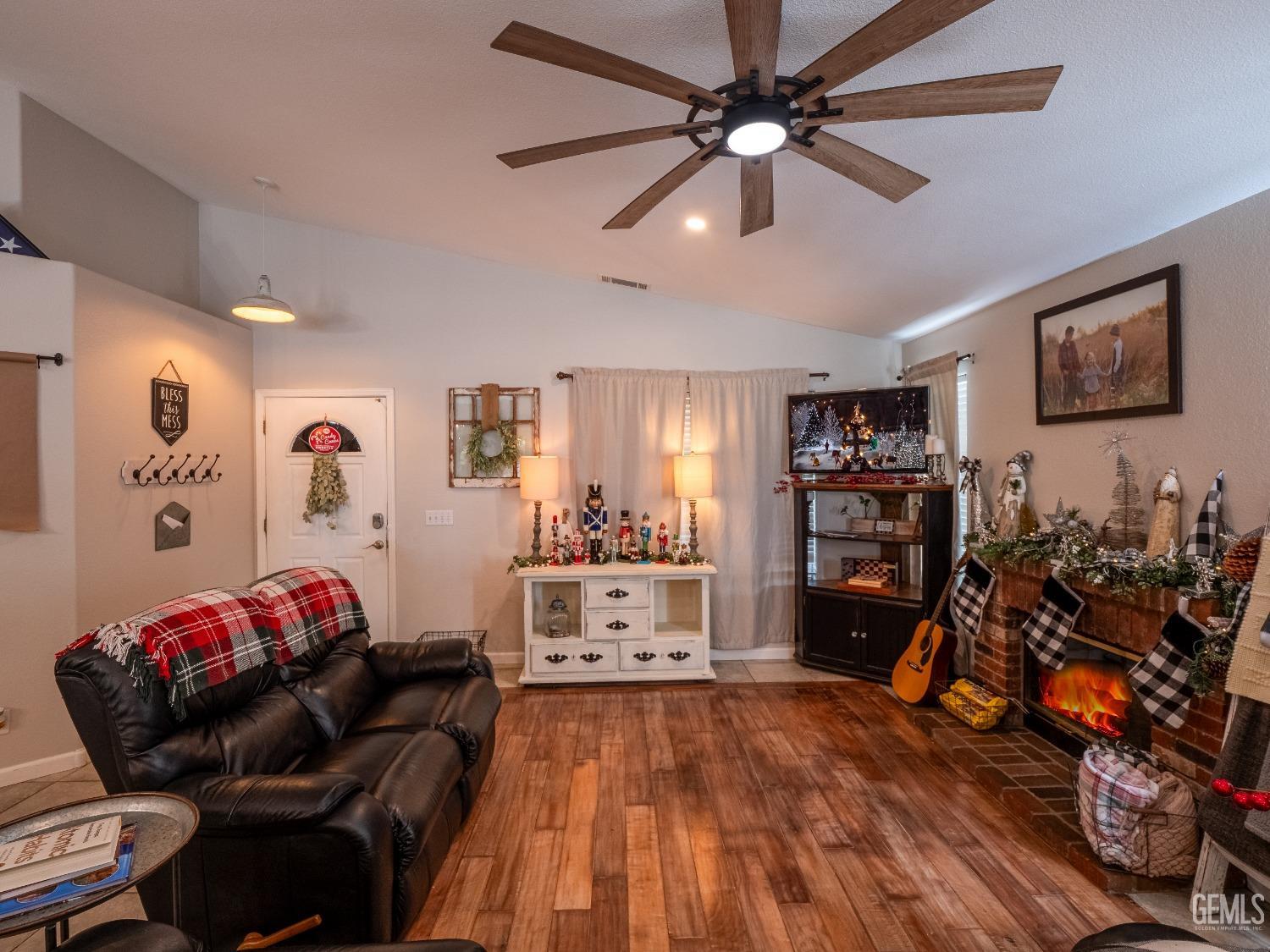 Undisclosed Address Bakersfield, CA 93312 - Photo 5 of 25 a bedroom with furniture and a wooden floor