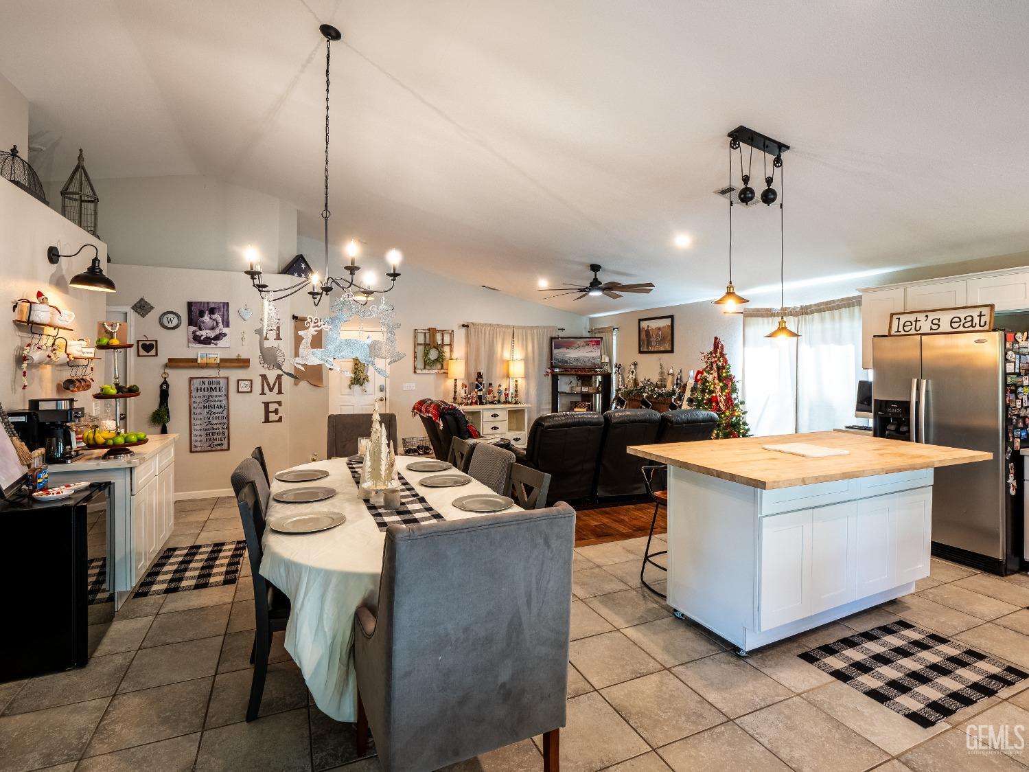 Undisclosed Address Bakersfield, CA 93312 - Photo 10 of 25 a living room with lots of furniture and chandelier