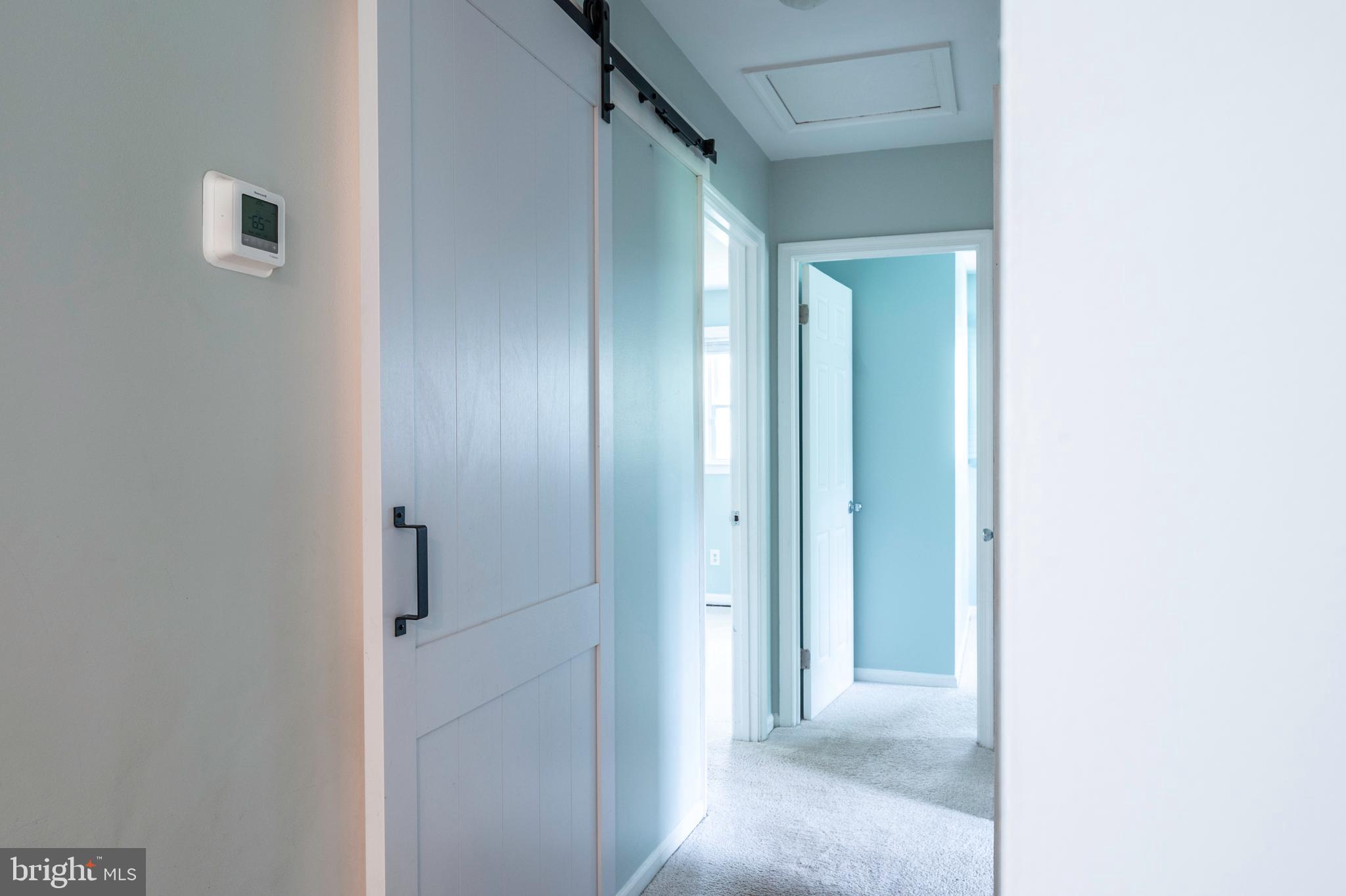 4520 Logmill Road Gainesville, VA 20155 - Photo 11 of 34 Barn door to bathroom