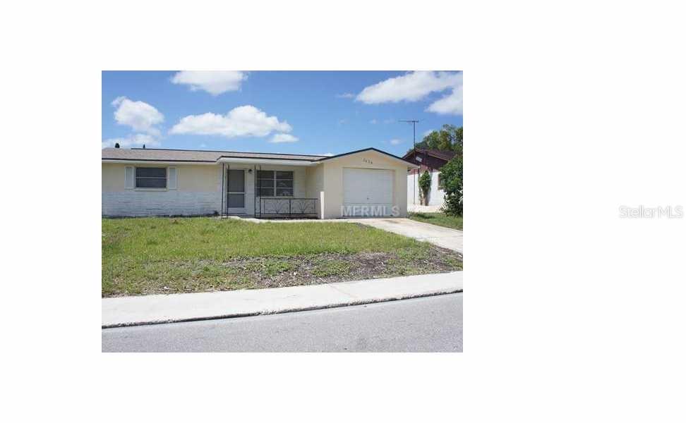7434 San Moritz Drive Port Richey, FL 34668 - Photo 1 of 1 a view of a house with a yard