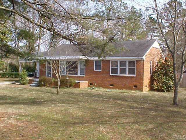 1102 Southerlund Road Garner, NC 27529 - Photo 1 of 1 a backyard of a house with large trees and outdoor seating