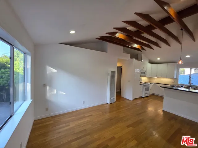 a view of a kitchen with a sink and cabinets