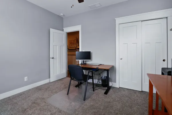 a view of a workspace with furniture