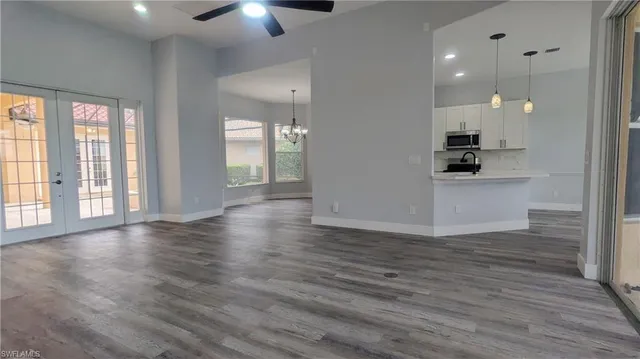 a view of a kitchen with a sink and a window