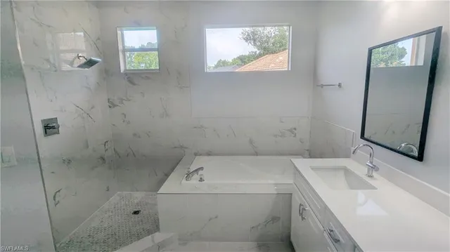 a bathroom with a sink and a shower