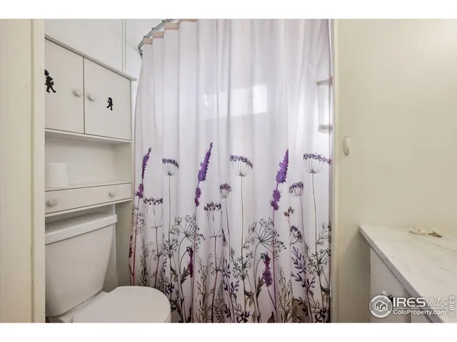 a bathroom with a sink and a shower curtain