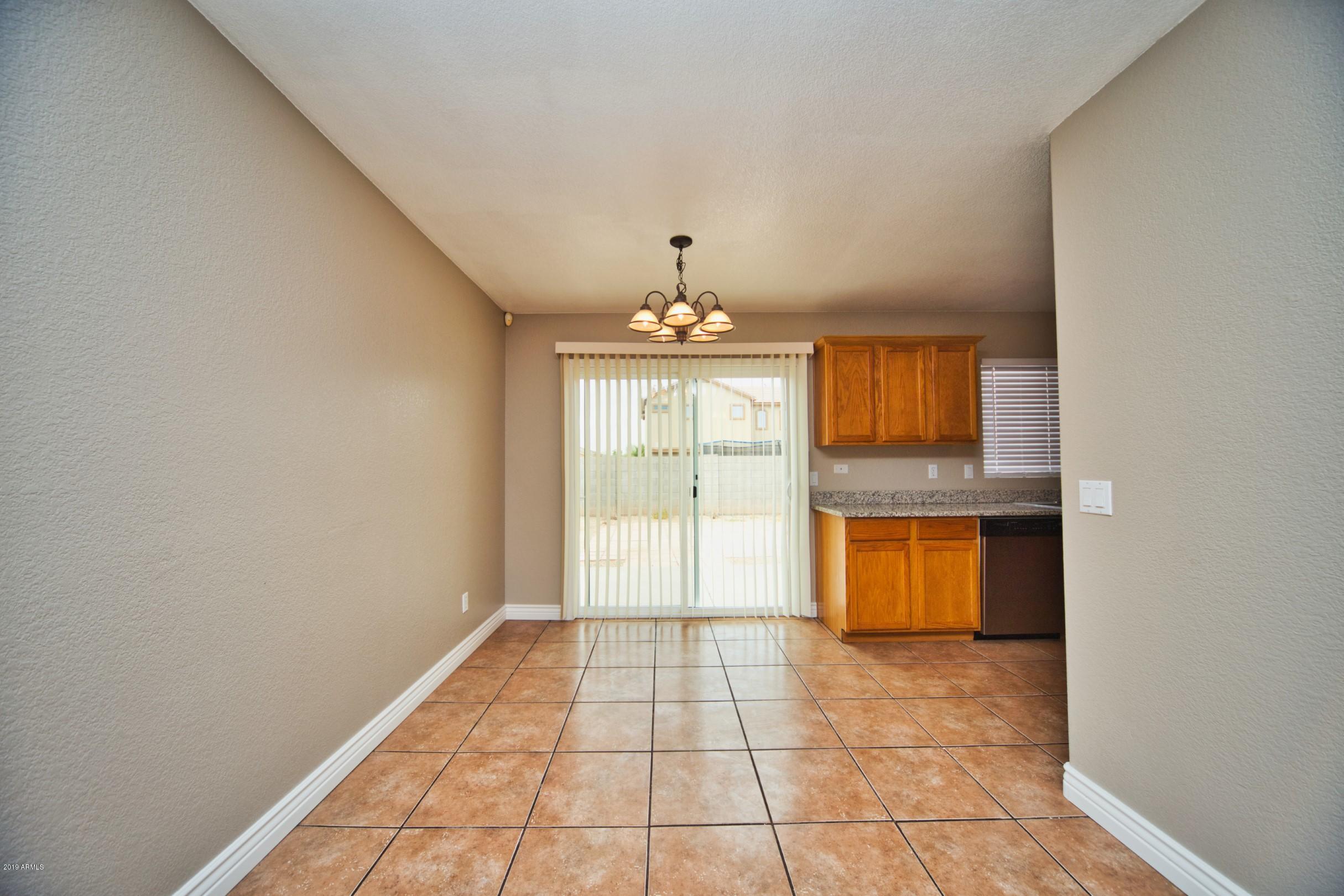6237 West Raymond Street Phoenix, AZ 85043 - Photo 11 of 39 a view of an empty room with window and bathroom