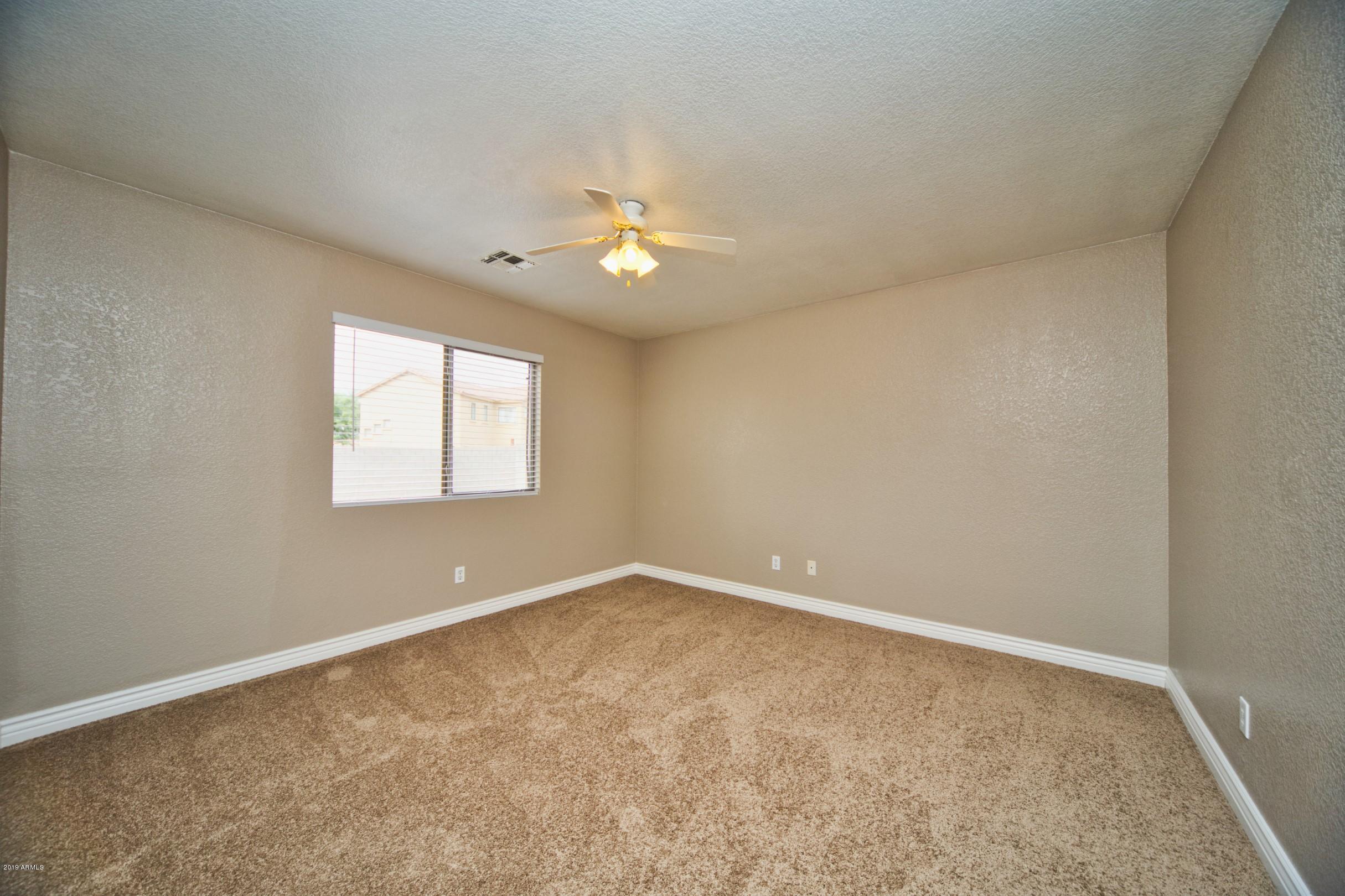 6237 West Raymond Street Phoenix, AZ 85043 - Photo 14 of 39 an empty room with a window