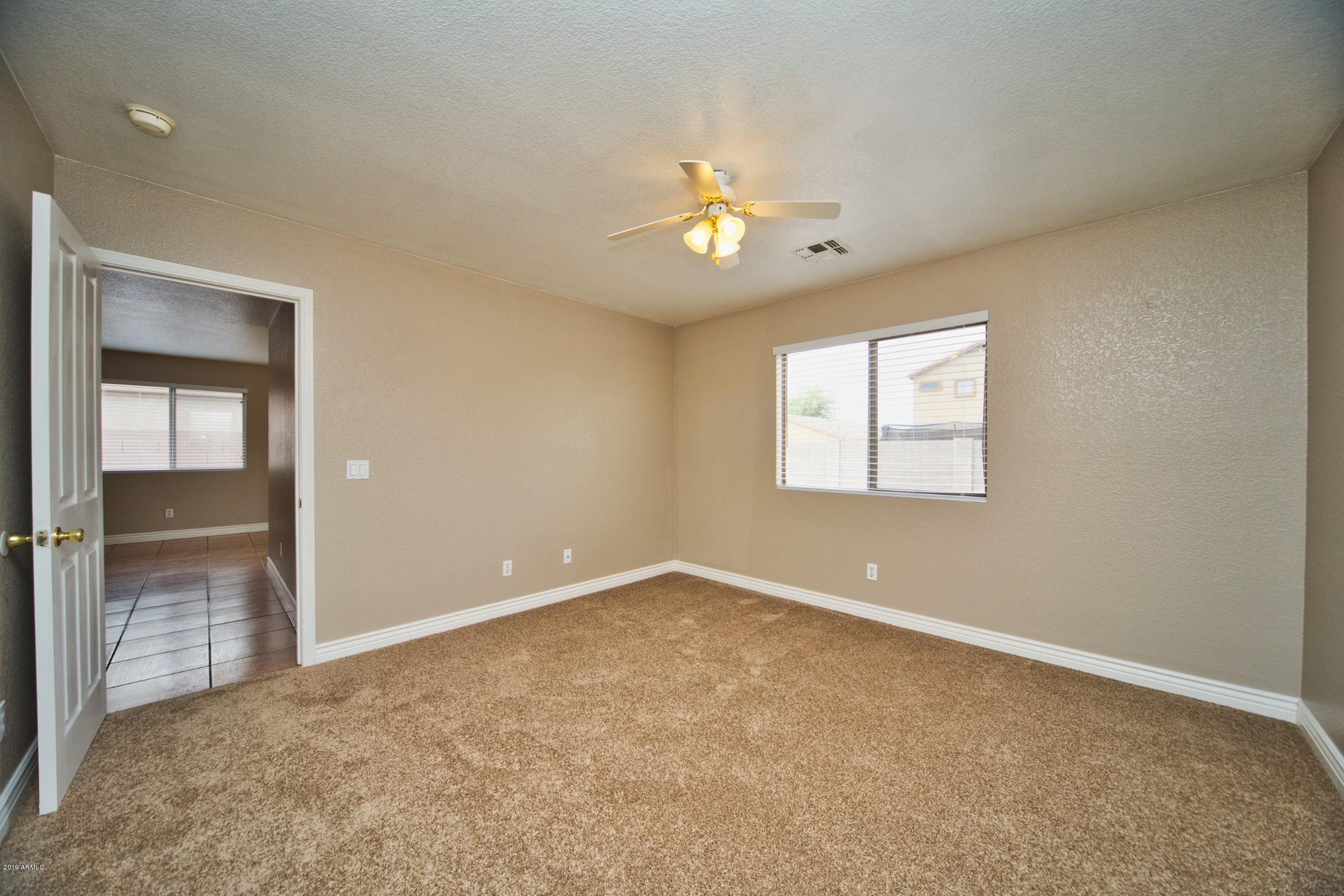 6237 West Raymond Street Phoenix, AZ 85043 - Photo 15 of 39 a view of an empty room with a window