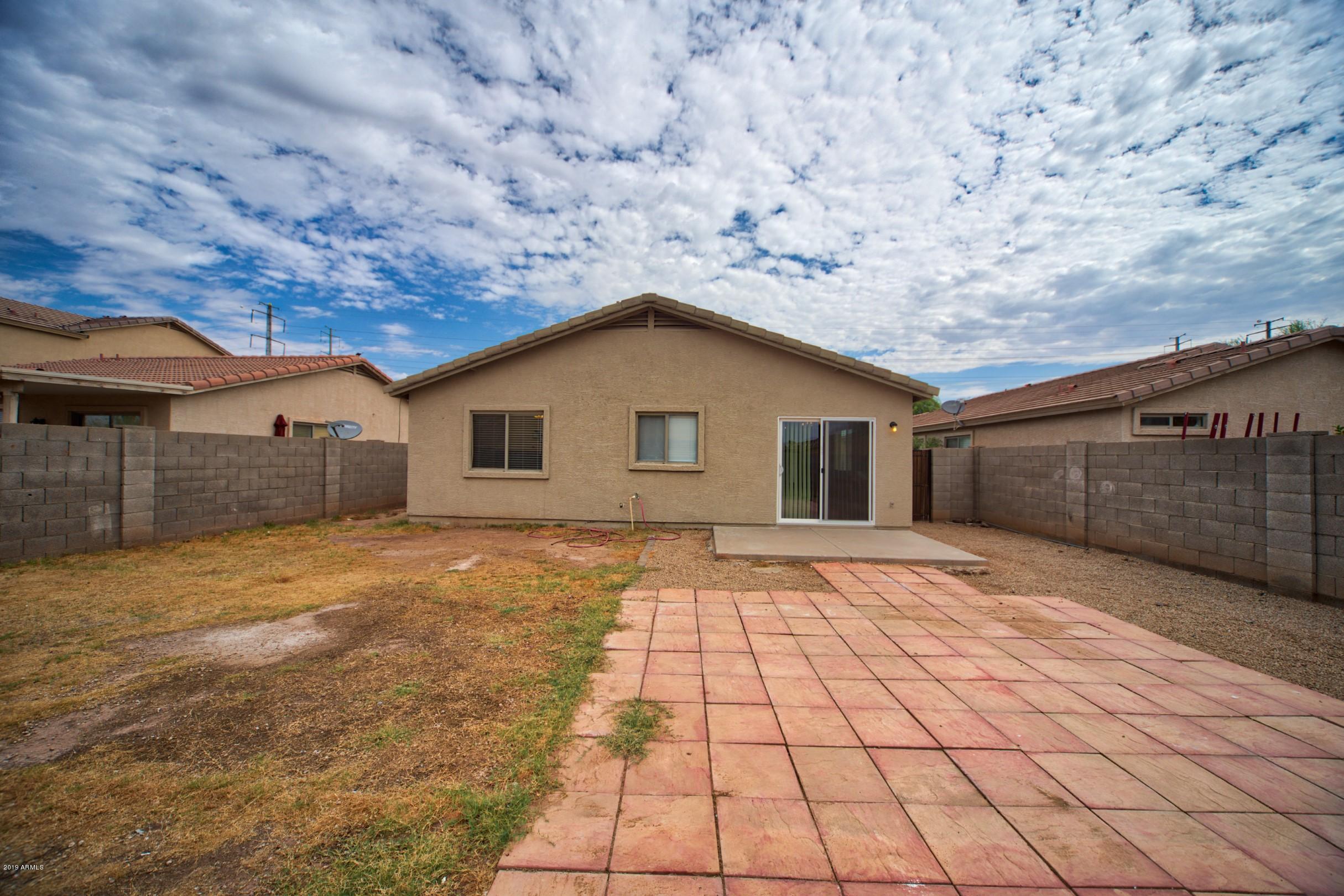 6237 West Raymond Street Phoenix, AZ 85043 - Photo 30 of 39 a house view with a backyard space