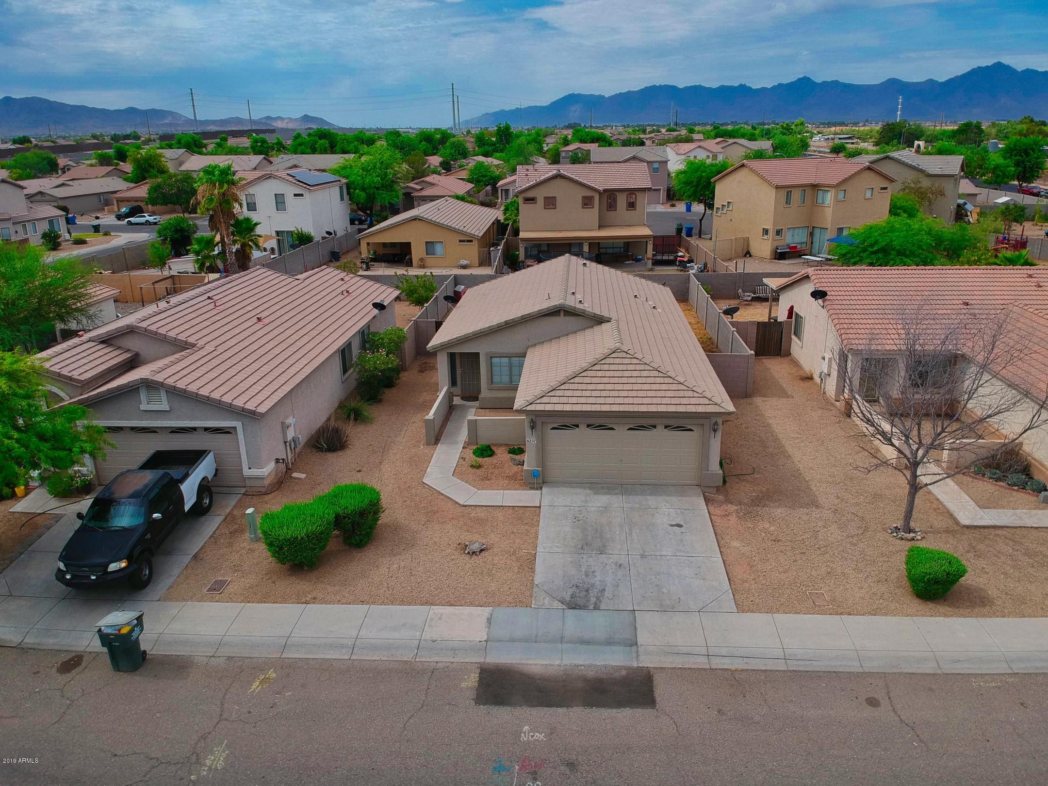 6237 West Raymond Street Phoenix, AZ 85043 - Photo 33 of 39 an aerial view of multiple houses with a street