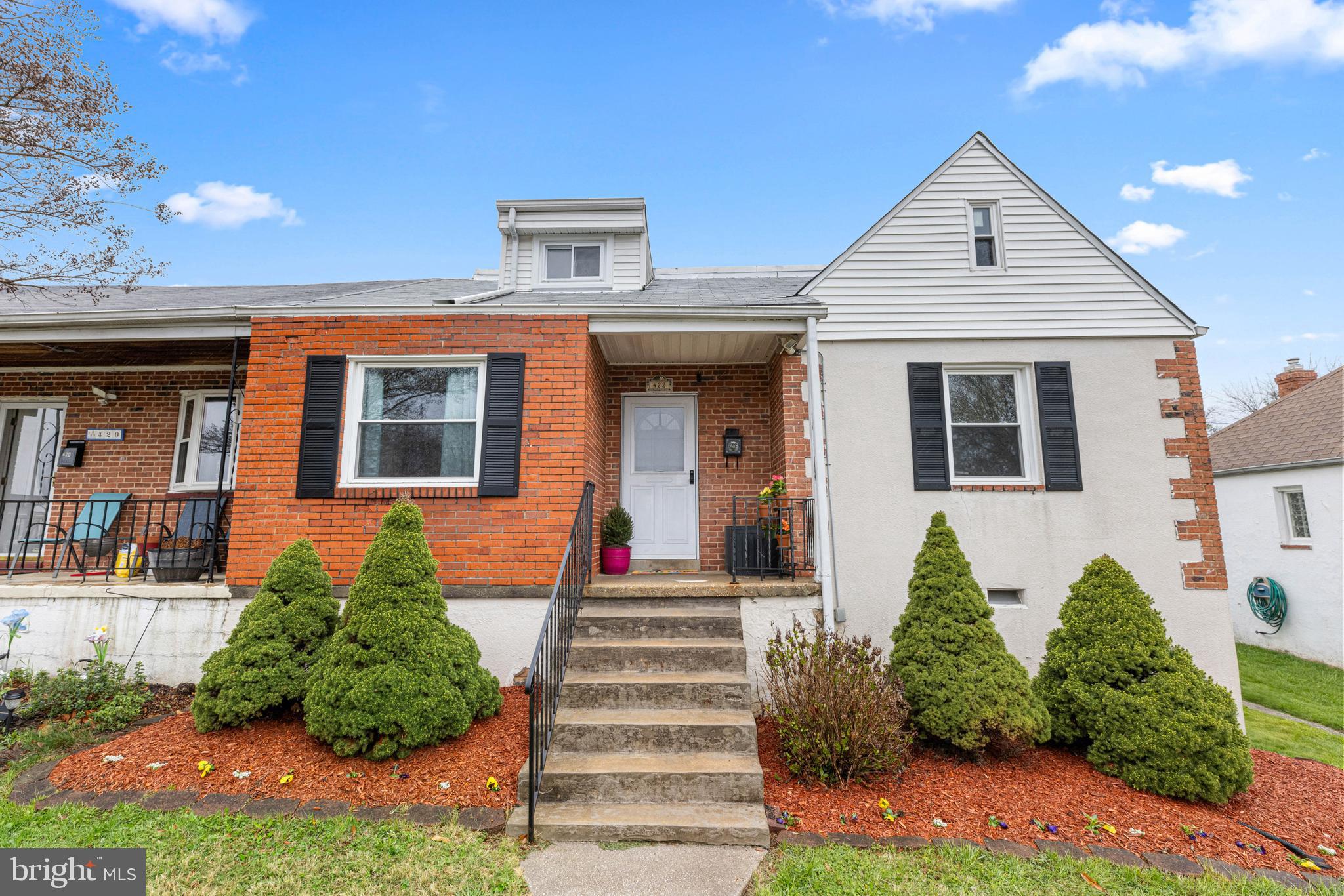 422 Elmwood Road Baltimore, MD 21206 - Photo 1 of 29 a front view of a house with a yard