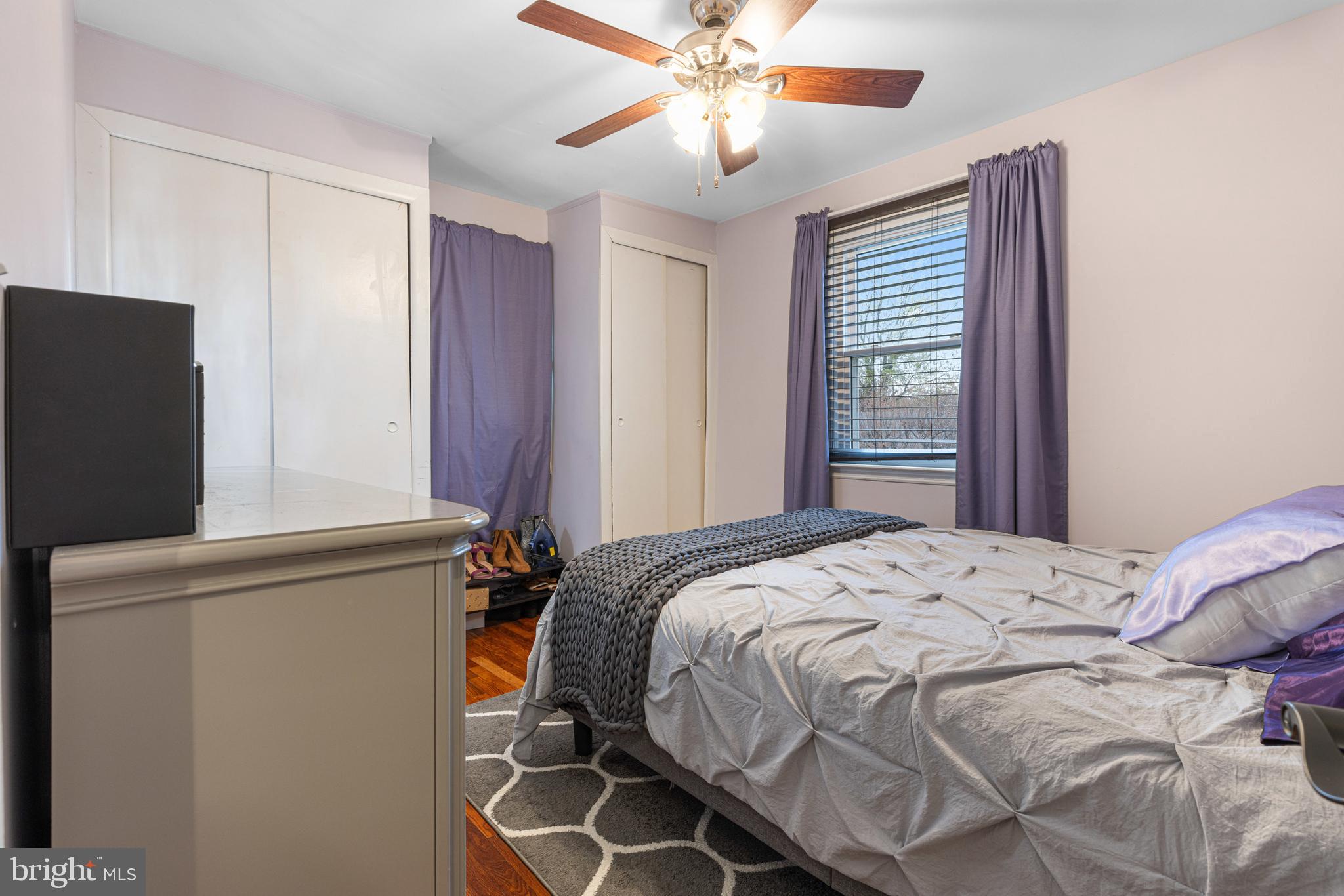 422 Elmwood Road Baltimore, MD 21206 - Photo 15 of 29 a bedroom with a bed and a chandelier