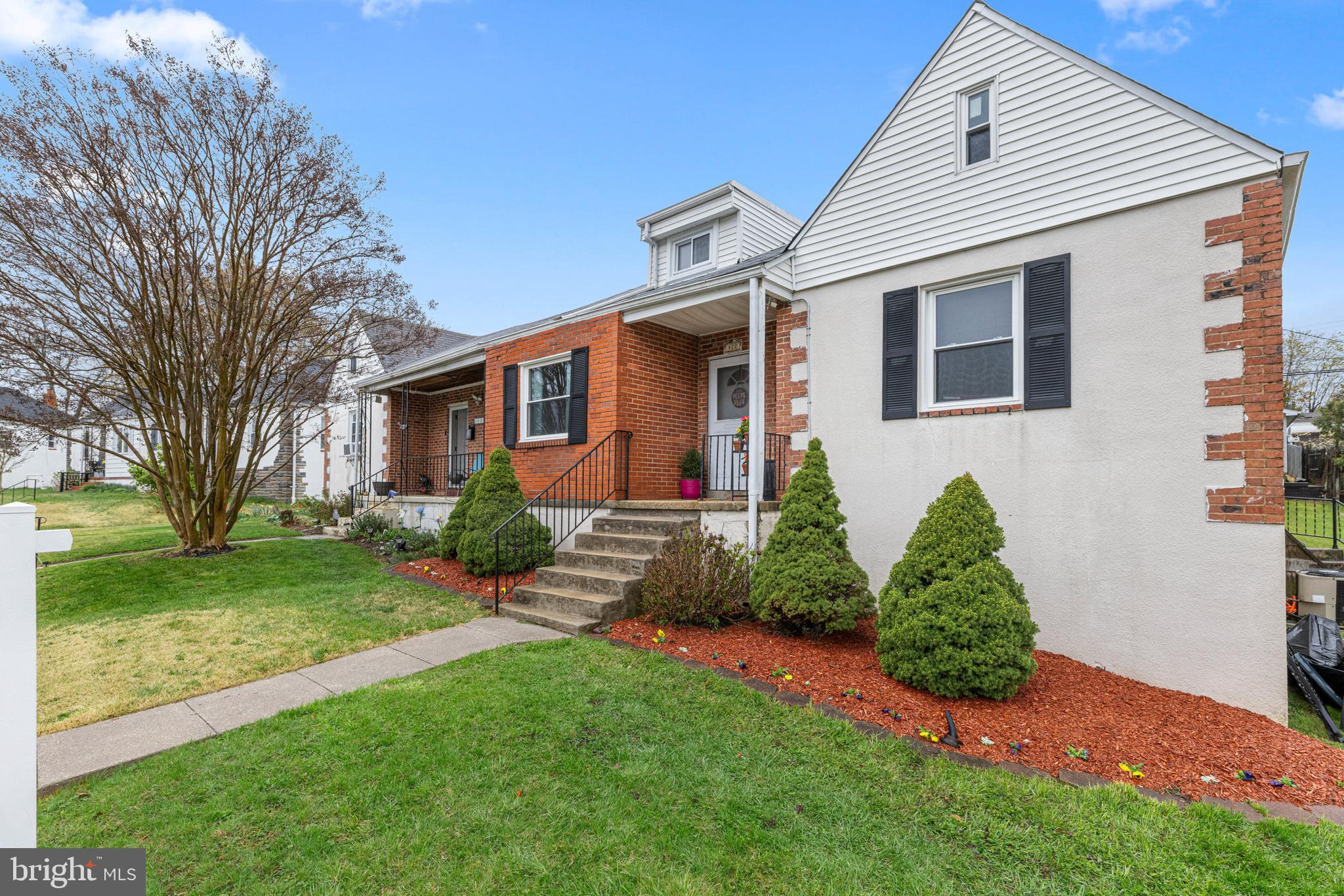 422 Elmwood Road Baltimore, MD 21206 - Photo 2 of 29 a front view of a house with garden