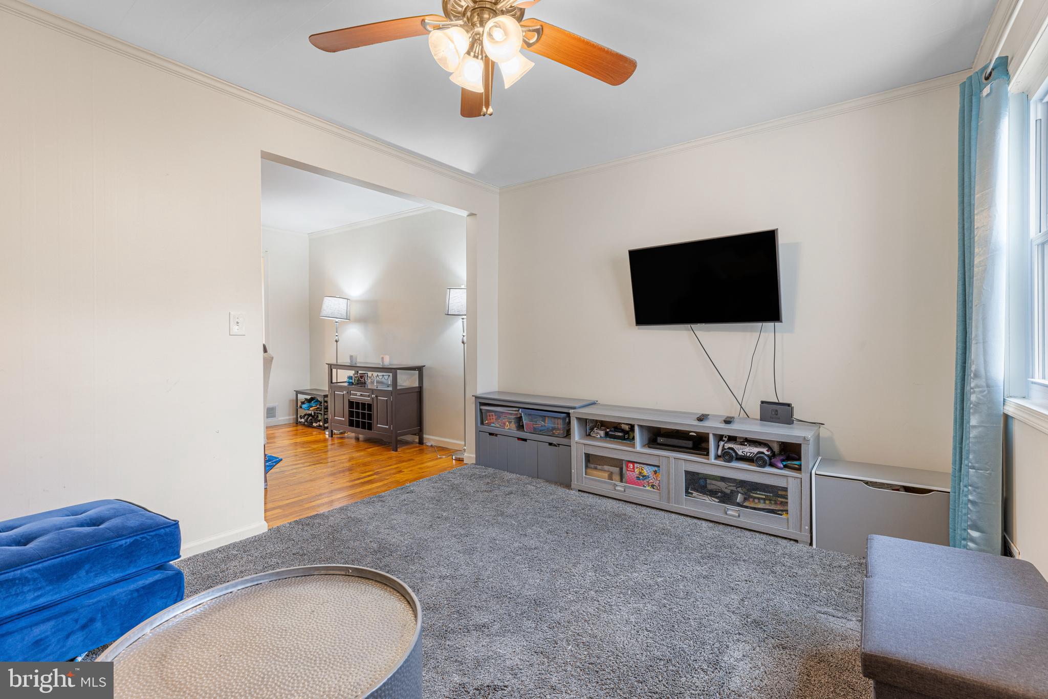 422 Elmwood Road Baltimore, MD 21206 - Photo 9 of 29 a living room with furniture and a flat screen tv