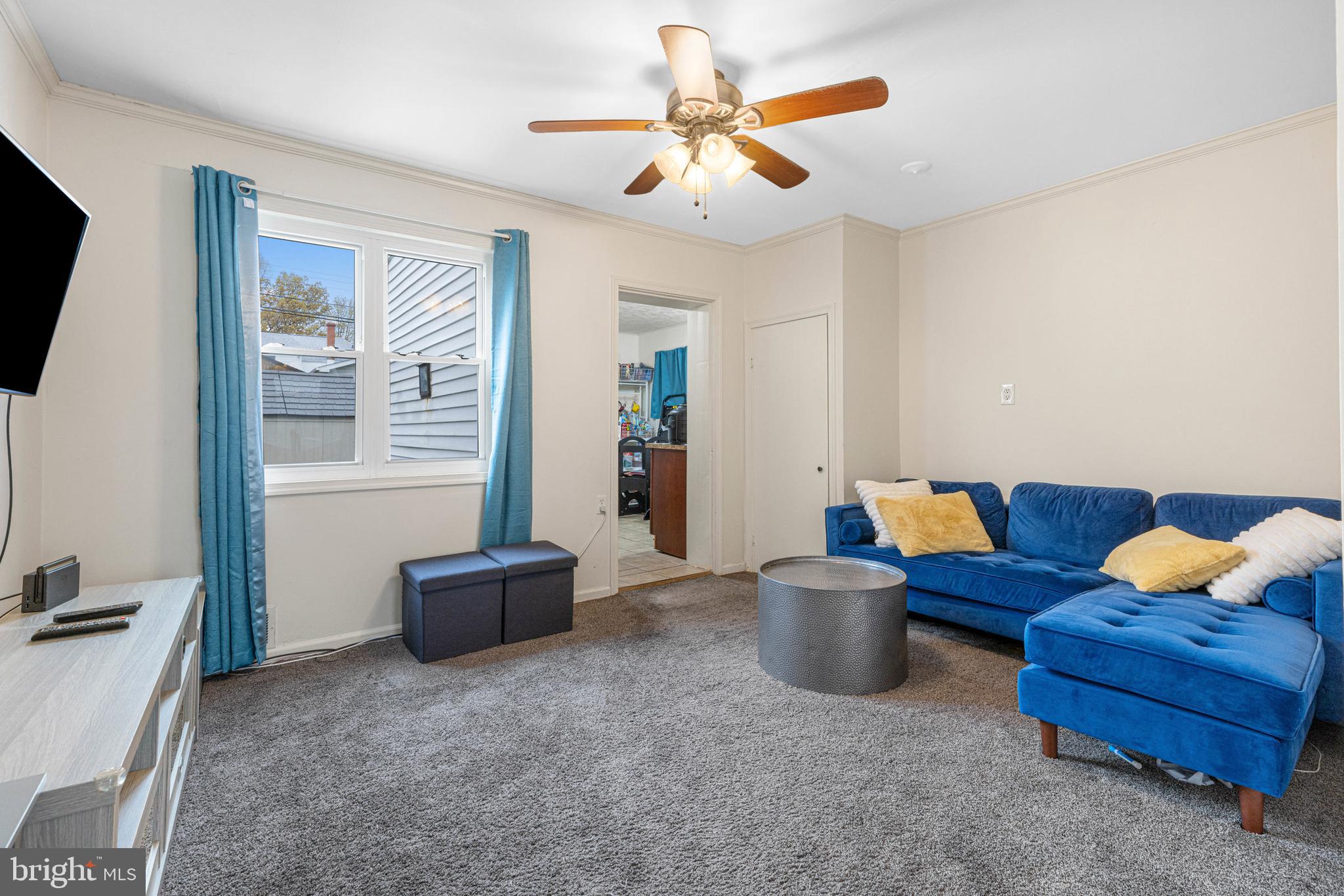 422 Elmwood Road Baltimore, MD 21206 - Photo 10 of 29 a living room with furniture and a flat screen tv
