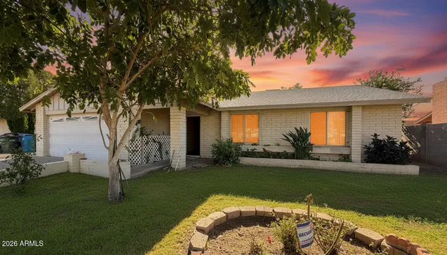 a view of a house with a yard