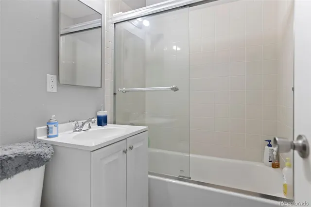 a bathroom with a sink a mirror and a bathtub