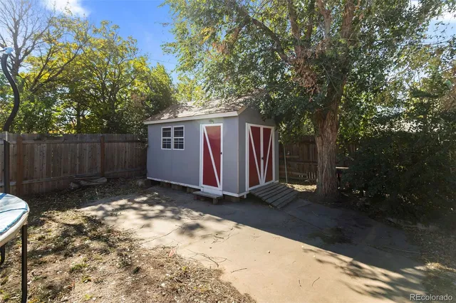 a backyard of a house with yard and outdoor seating