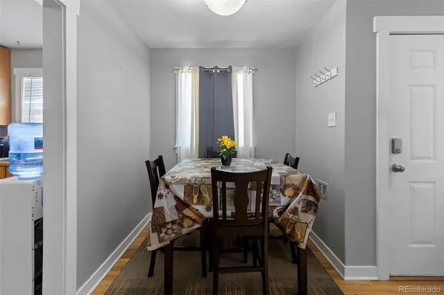 a dining room with furniture and window
