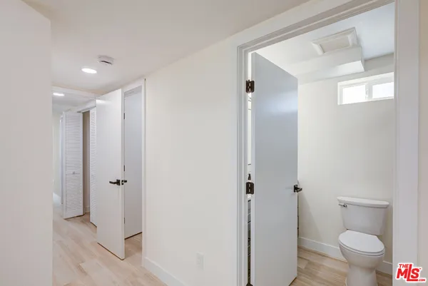 a bathroom with a shower and a toilet