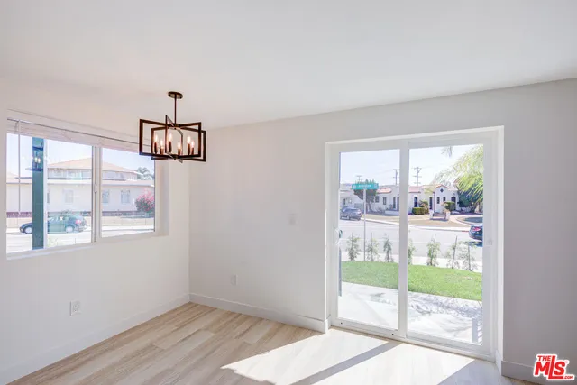 a view of a room with window wooden floor