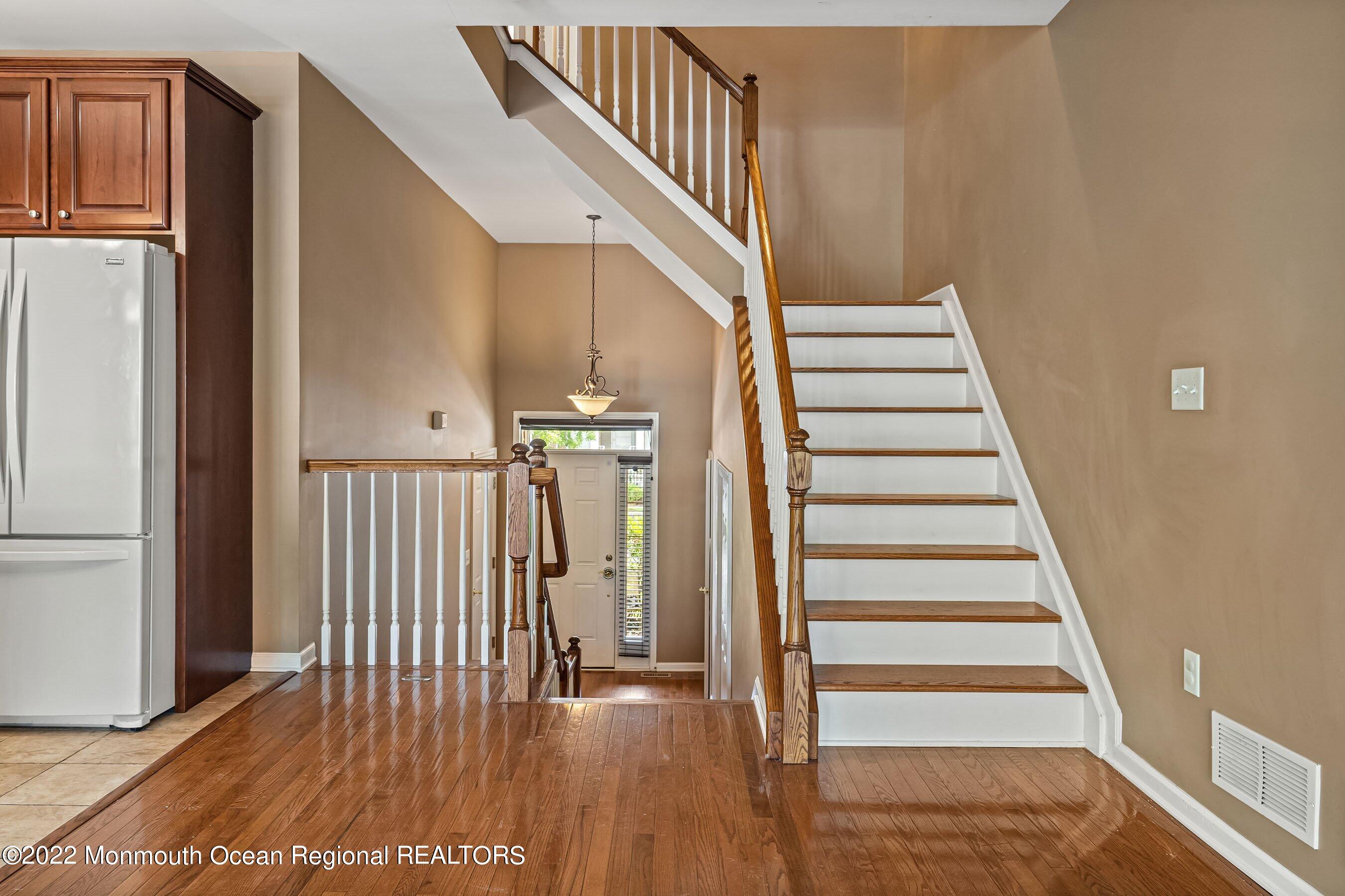 107 Bryce Lane, Unit 2004 Manahawkin, NJ 08050 - Photo 18 of 39 a view of entryway with wooden floor