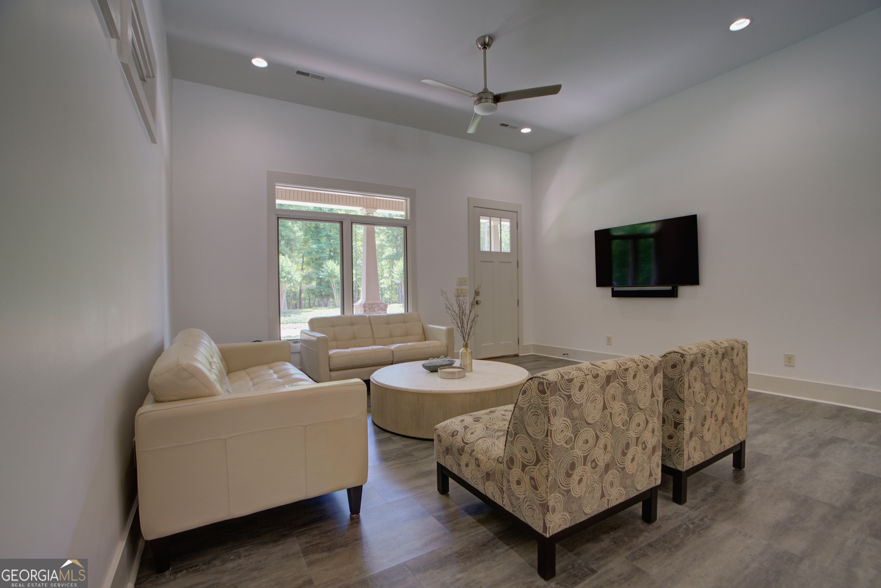 610 Kings Bridge Road Cave Spring, GA 30124 - Photo 8 of 72 a living room with furniture and a flat screen tv