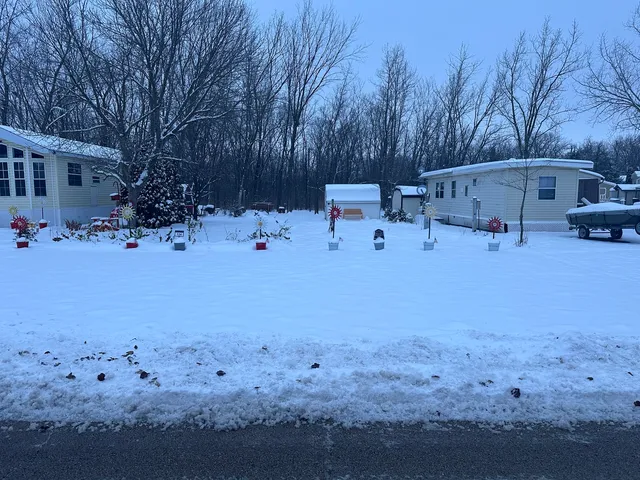 a view of backyard with a table and chairs