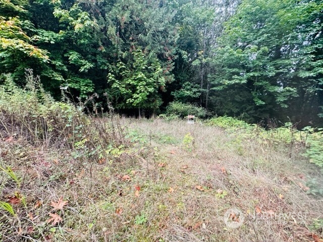 2 West Sherman Heights Road Bremerton, WA 98312 - Photo 3 of 13 a view of a yard with plants and tree