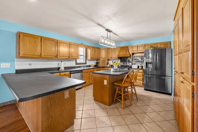 a view of a livingroom with furniture and a flat screen tv