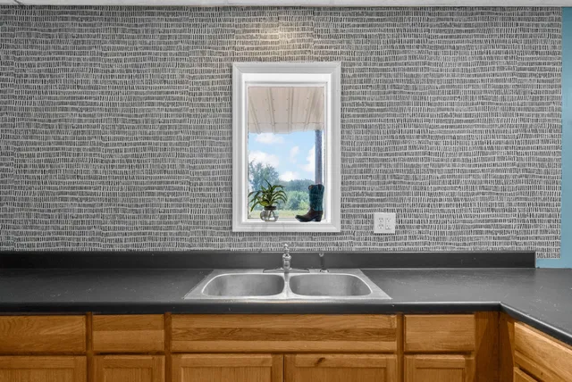 a view of a house with backyard and entertaining space