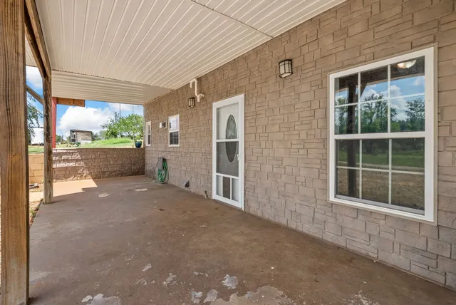 a view of a garden with an outdoor space