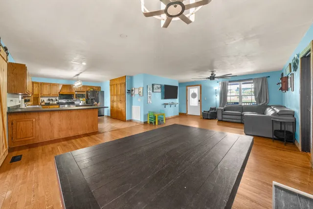 a kitchen with granite countertop cabinets and window