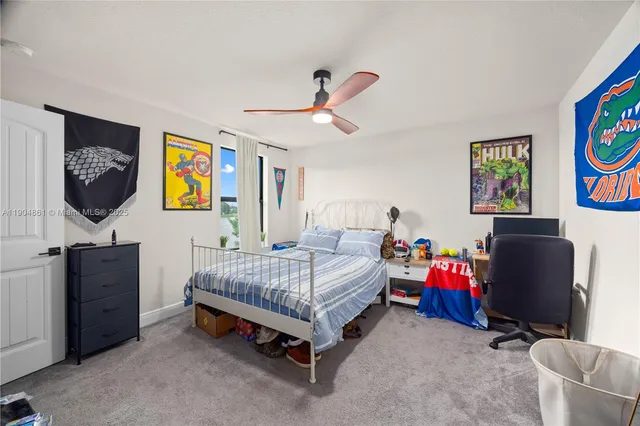 a bathroom with a sink a toilet a mirror and shower