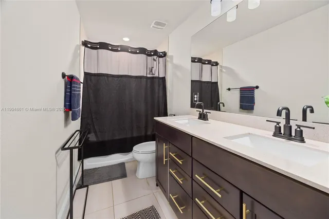 a living room with couch and a floor to ceiling window