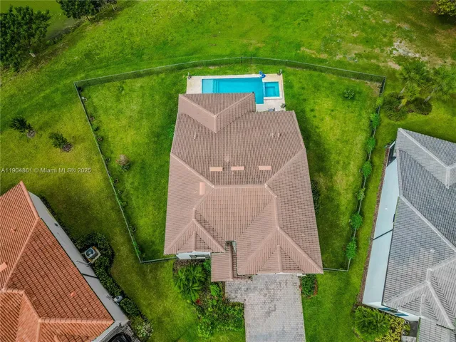 an aerial view of a house with garden space and outdoor space