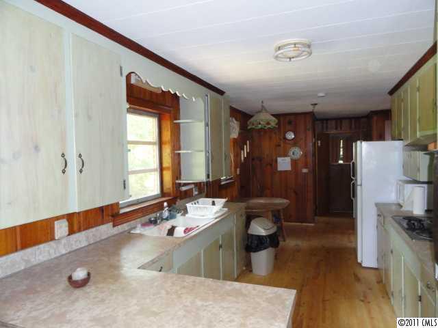 1300 Shearers Road Mooresville, NC 28115 - Photo 2 of 7 a bathroom with a tub sink and mirror
