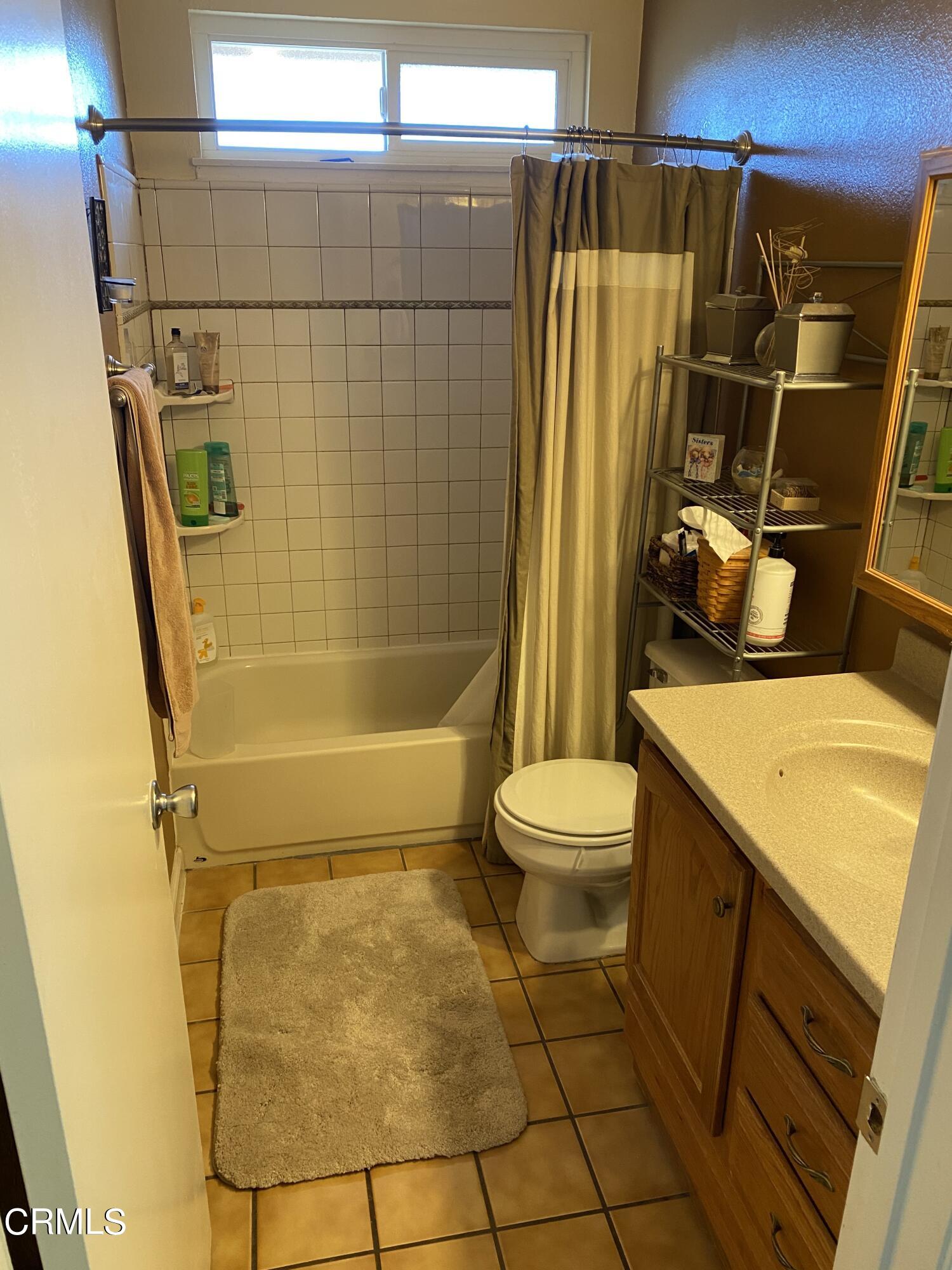 3470 Taffrail Lane Oxnard, CA 93035 - Photo 14 of 15 a bathroom with a granite countertop sink toilet and shower