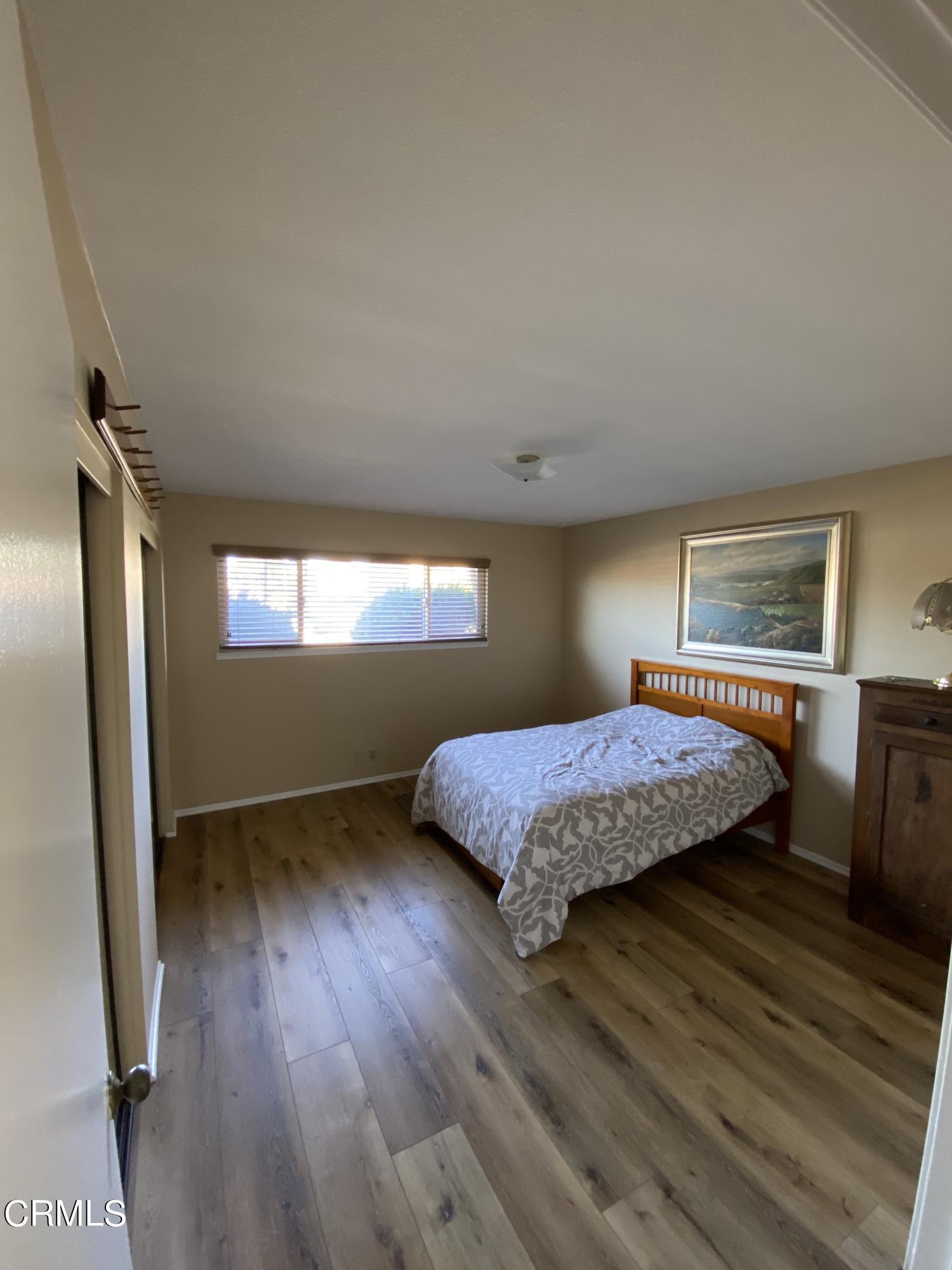 3470 Taffrail Lane Oxnard, CA 93035 - Photo 9 of 15 a bedroom with a bed and a window