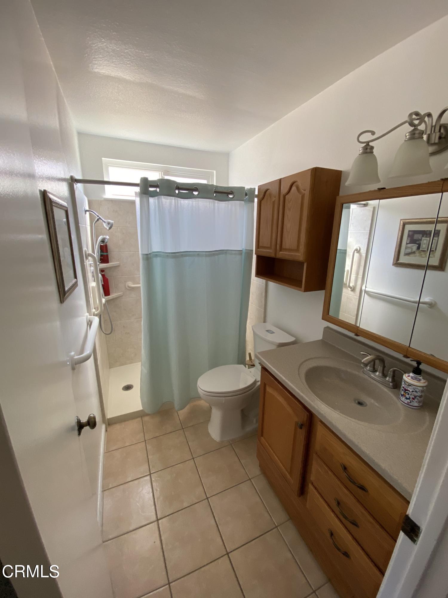 3470 Taffrail Lane Oxnard, CA 93035 - Photo 10 of 15 a bathroom with a sink toilet and shower