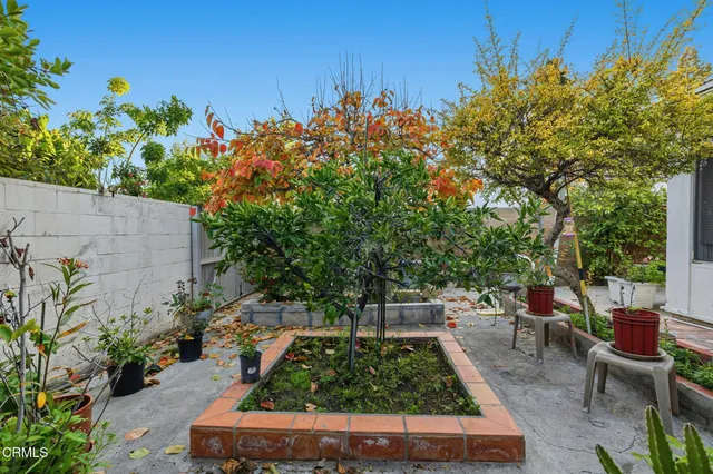 a view of a backyard with sitting area