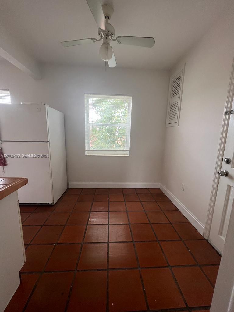 1421 Southwest 37th Avenue, Unit 3 Miami, FL 33145 - Photo 14 of 17 a view of an empty room with a window