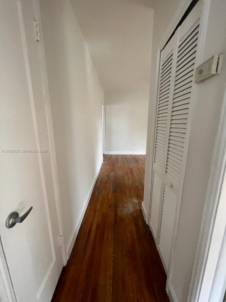 1421 Southwest 37th Avenue, Unit 3 Miami, FL 33145 - Photo 17 of 17 a view of a hallway and wooden floor
