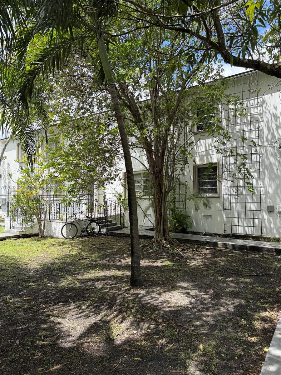 1421 Southwest 37th Avenue, Unit 3 Miami, FL 33145 - Photo 2 of 17 a view of a yard with a tree