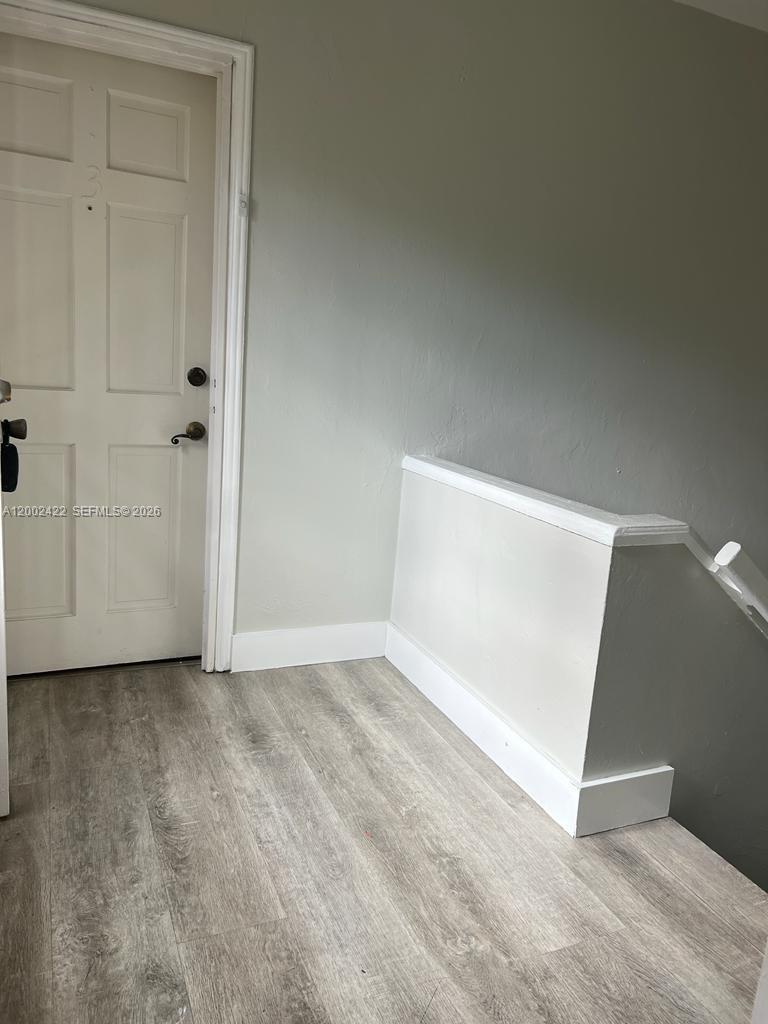 1421 Southwest 37th Avenue, Unit 3 Miami, FL 33145 - Photo 4 of 17 an empty room with closet