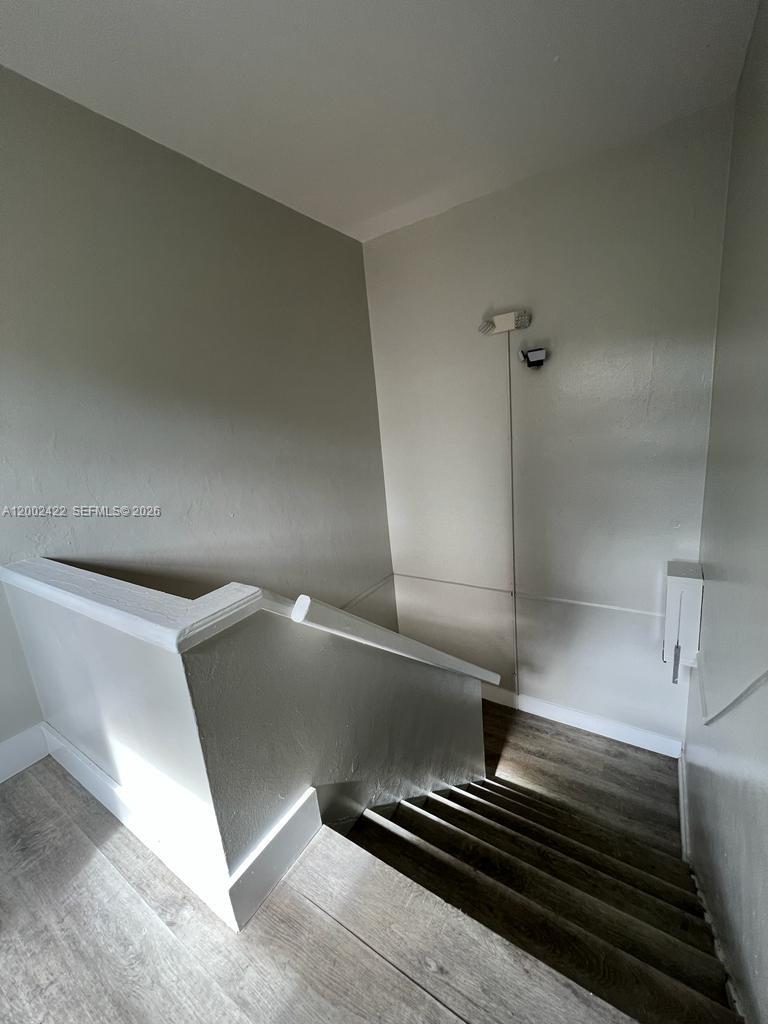 1421 Southwest 37th Avenue, Unit 3 Miami, FL 33145 - Photo 5 of 17 a view of an empty room with wooden floor