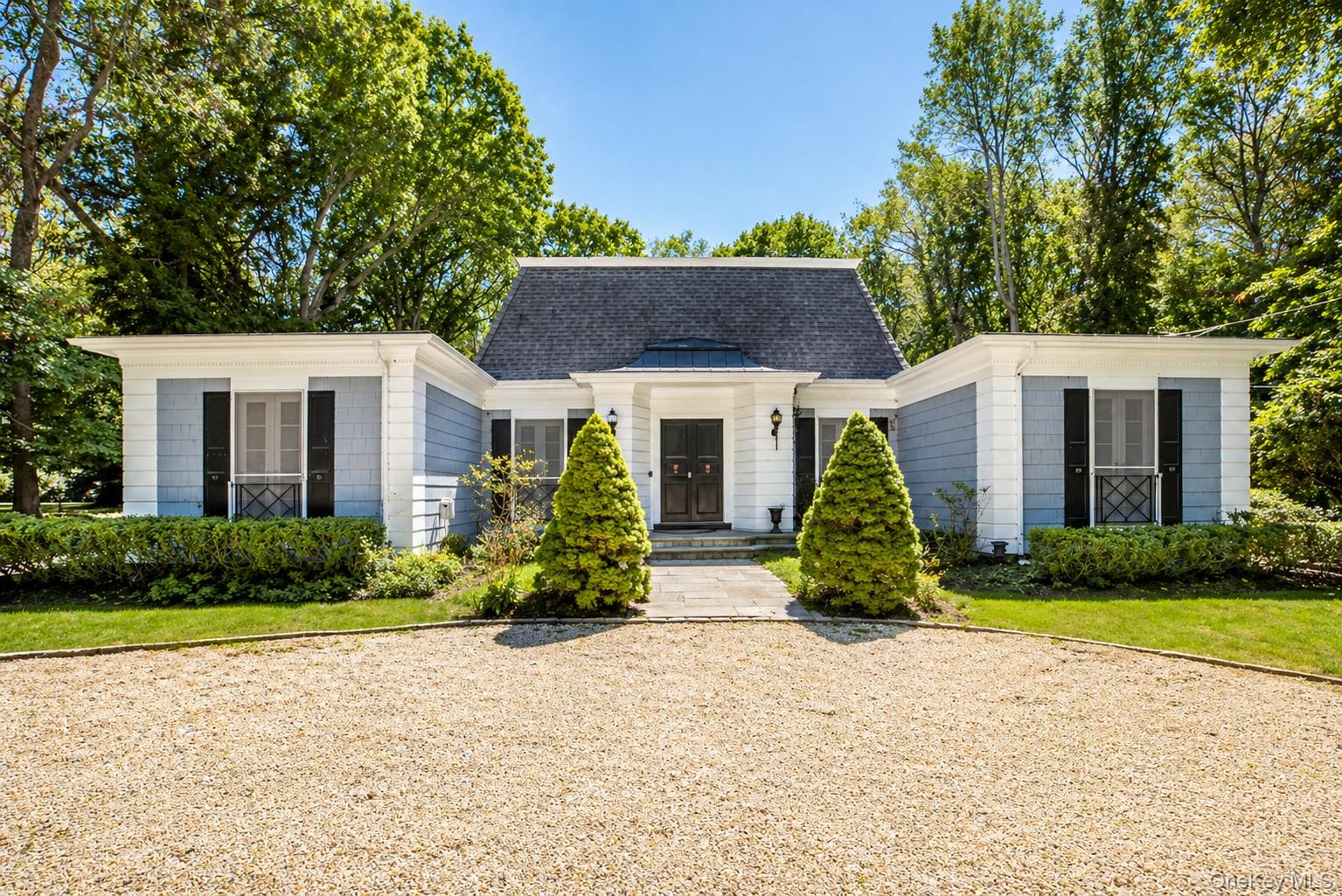 704 Short Beach Road Nissequogue, NY 11780 - Photo 1 of 25 front view of a house with a yard