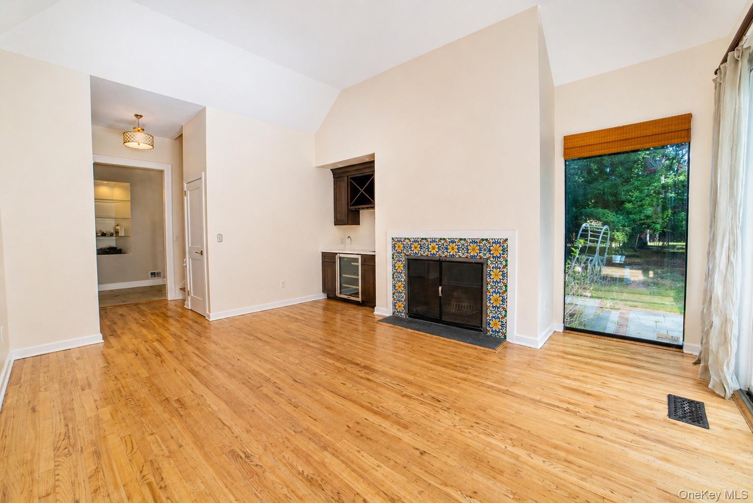 704 Short Beach Road Nissequogue, NY 11780 - Photo 11 of 25 a view of empty room with floor to ceiling window and fireplace